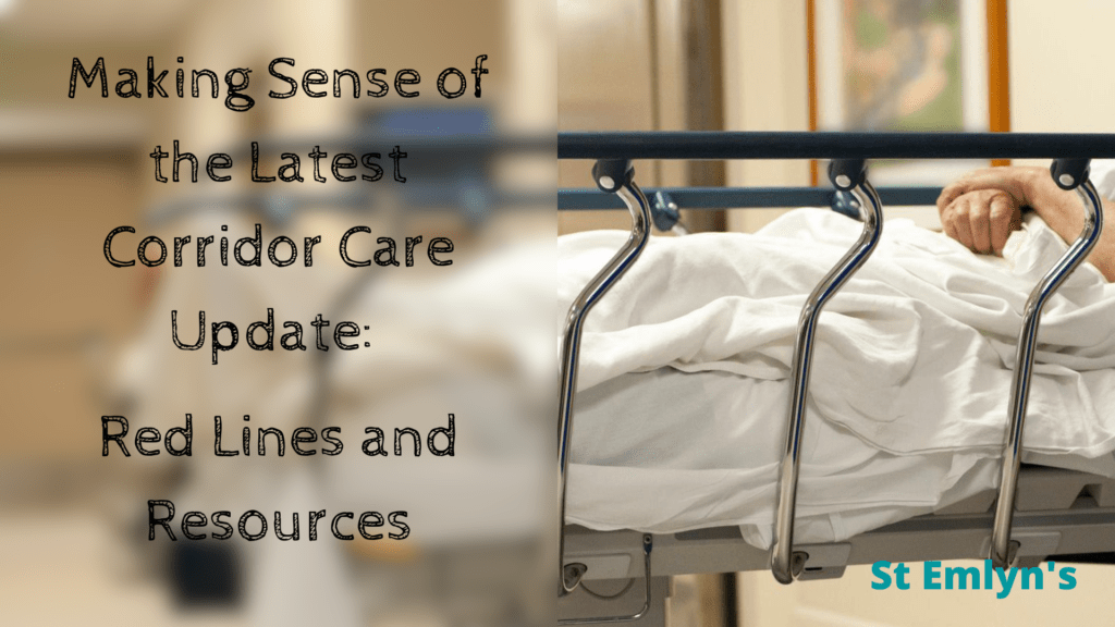 Partial view of a hospital trolley in the corridor with a patient's hands visible