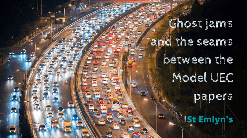 Heavy multi-lane traffic with the title, Ghost jams and the seams between the Model UEC papers